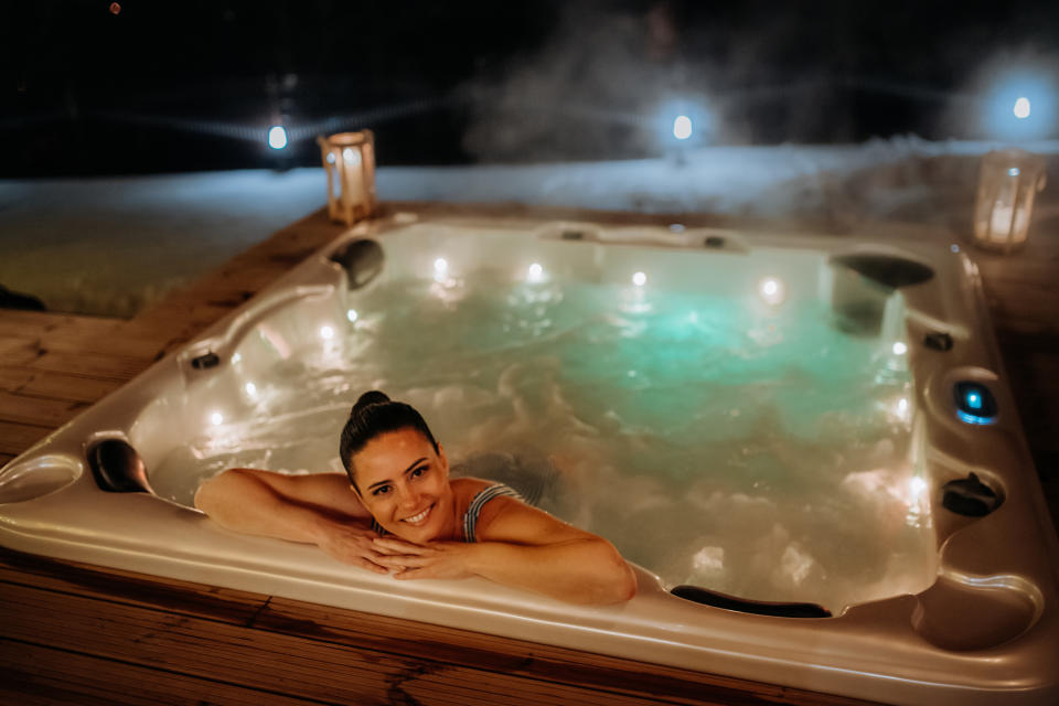person lounging in a hot tub