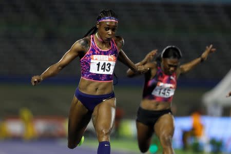 Athletics - JAAA National Senior Championships - National Stadium Kingston, Jamaica - June 23, 2017 Jamaica's Elaine Thompson (L) and Christania Williams in action during the Women's 100m final REUTERS/Lucy Nicholson