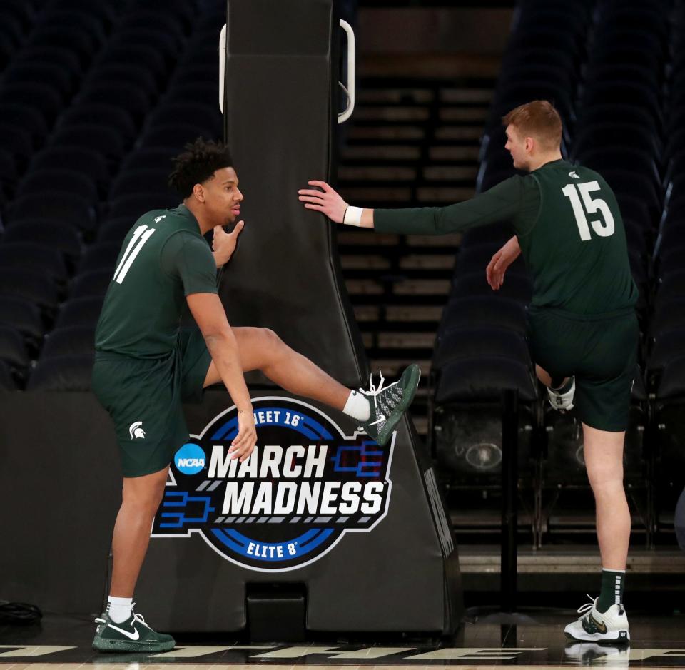 Michigan State guard A.J. Hoggard and center Carson Cooper stretch during practice on Wednesday, March 22, 2023, in preparation of the East Regional semifinal against Kansas State in the NCAA tournament.