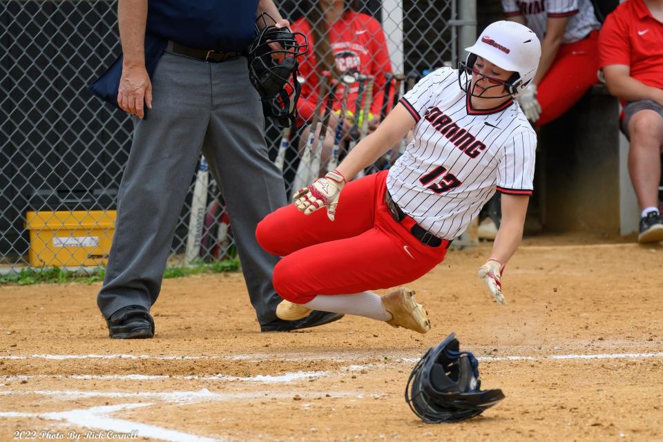 Grace Vondracek slides home for a run during Corning Community College's 11-2 win over Niagara County Community College in an NJCAA regional final May 20, 2022 in Corning.