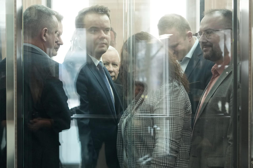 Poland's main opposition leader, Jaroslaw Kaczynski, center, arrives to be questioned by a parliamentary commission at the parliament building, in Warsaw, Poland, Friday, March 15, 2024. Kaczynski appeared before a special parliamentary committee Friday to testify about the purchase and allegedly illegal use of advanced spyware by a government headed by his Law and Justice Party. The NSO Group's Pegasus spyware was used to spy on mobile devices belonging to opponents of the party. Recent findings suggest it was also used to eavesdrop on some key members of the right-wing party, as well. (AP Photo/Czarek Sokolowski)