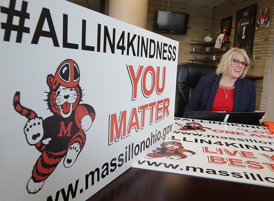 Massillon Mayor Kathy Catazaro-Perry laughs surrounded by kidness signs as she tells a story of the kindness campaign initative, #Allin4Kindness, that is taking hold in some Stark County schools.

(IndeOnline.com / Kevin Whitlock)