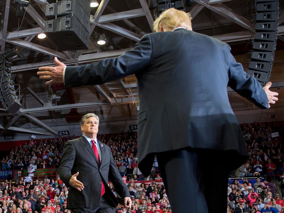 US President Donald Trump greets talk show host Sean Hannity at a Make America Great Again rally in Cape Girardeau, Missouri on November 5, 2018: JIM WATSON/AFP/Getty Images