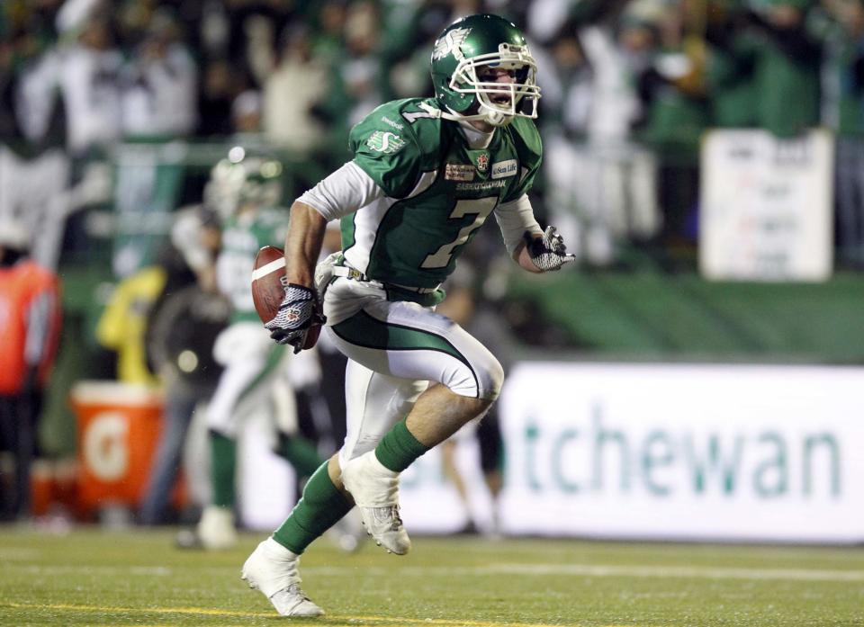The Saskatchewan Roughriders Weston Dressler celebrates after scoring a touchdown against the Hamilton Tiger-Cats during the second half of the CFL's 101st Grey Cup championship football game in Regina, Saskatchewan November 24, 2013. REUTERS/David Stobbe (CANADA - Tags: SPORT FOOTBALL)