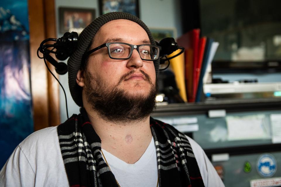 Keith Gurgui sits for a portrait at his home in Lake Katrine, NY on Monday, March 28, 2022. Keith had an accident in 2009 that left him paralyzed from the shoulders down; he's advocating for better wages for home caregivers.