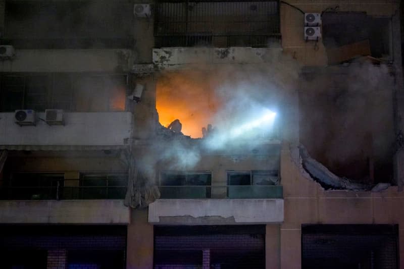 Lebanese firefighters search for survivors at a building targeted in a blast, that resulted in killing Hamas deputy leader Saleh al-Arouri an six other people. The cause was initially unclear but reports quickly began to circulate suspecting that it could have been a targeted killing on behalf of Israel. Stringer/dpa