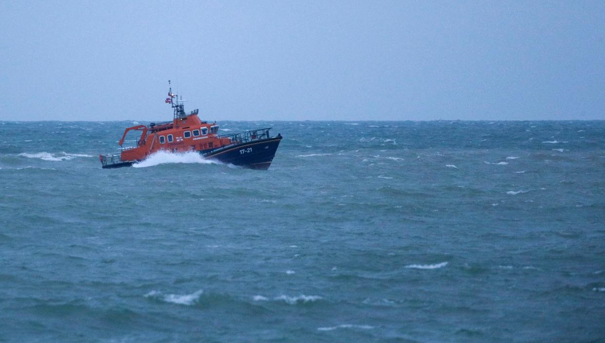 The RNLI severn class Lifeboat head to Newhaven harbour after searching for the missing two fishermen that went missing near Seaford, Sussex, when their fishing boat,  Joanna C, sank off the coast near Seaford, East Sussex on Saturday.  (Steve Parsons/PA Wire)