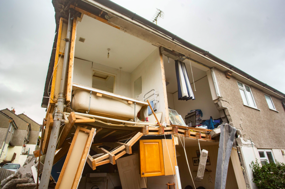 The explosion left the house exposed, with a bath seen sitting at the edge. (SWNS)