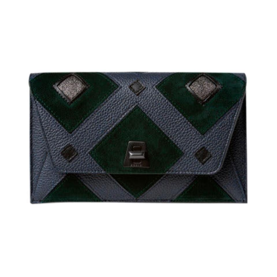 <p><a href="https://us.akris.com/collections/anouk-handbags/products/envelope-in-tiled-roof-patchwork-graphite-pacific" rel="nofollow noopener" target="_blank" data-ylk="slk:Shop Now;elm:context_link;itc:0;sec:content-canvas" class="link ">Shop Now</a></p><p>Envelope in Tiled Roof Patchwork</p><p>akris.com</p><p>$1590.00</p>