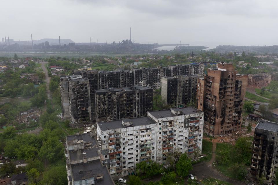 An aerial view of damaged residential buildings and the Azovstal steel plant in the background in the port city of Mariupol (AFP via Getty Images)