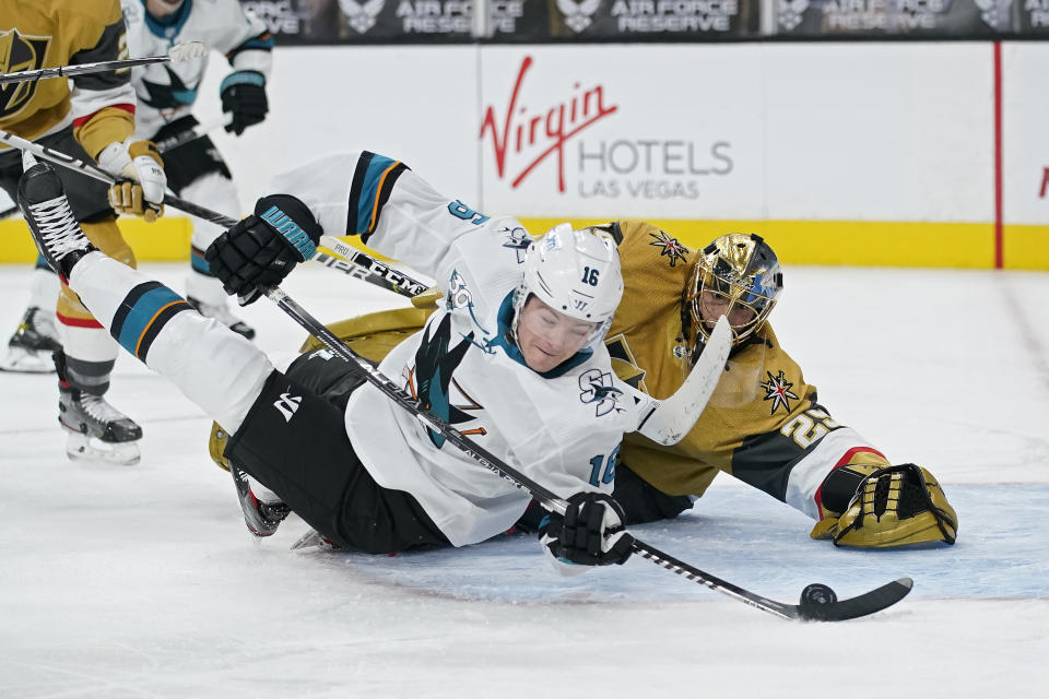 San Jose Sharks center Ryan Donato (16) attempts a shot on Vegas Golden Knights goaltender Marc-Andre Fleury (29) during the third period of an NHL hockey game Wednesday, April 21, 2021, in Las Vegas. (AP Photo/John Locher)