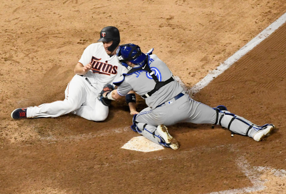 MINNEAPOLIS, MN - APRIL 16: Danny Jansen #9 of the Toronto Blue Jays tags out C.J. Cron #24 of the Minnesota Twins at home plate to end the game on April 16, 2019 at Target Field in Minneapolis, Minnesota. The Blue Jays defeated the Twins 6-5. (Photo by Hannah Foslien/Getty Images)