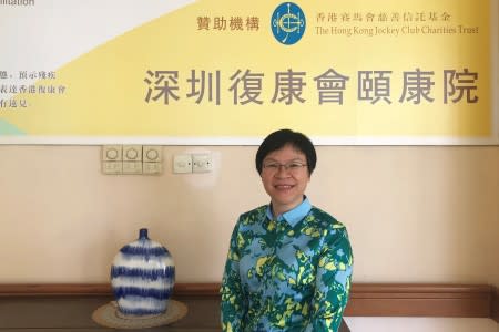 Jackie Mo, superintendent of Yee Hong Heights, poses for pictures at the Shenzhen senior care home managed by a Hong Kong charitable organization, in Shenzhen