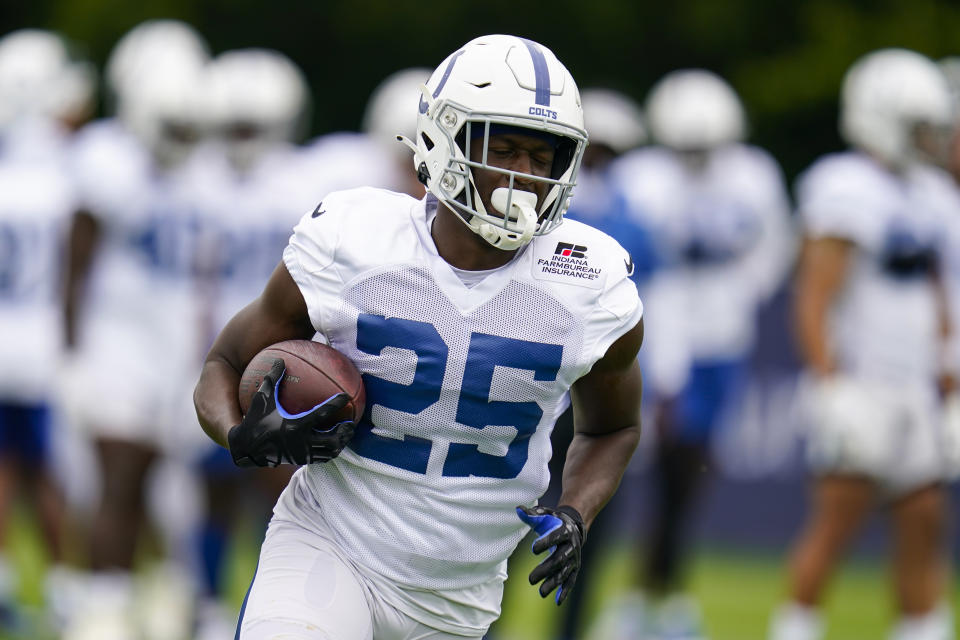 Indianapolis Colts running back Marlon Mack runs a drill during practice at the NFL team's football training camp in Westfield, Ind., Saturday, July 31, 2021. (AP Photo/Michael Conroy)