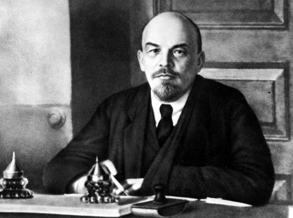 FILE - Vladimir Lenin, the founder of the Soviet Union is shown in at work at an unknown location of Russia in 1918. Shortly after his death in 1924, a poet proclaimed words that thrilled the grieving country: "Lenin lived, Lenin lives, Lenin will live." But a century later, Lenin is largely an afterthought in modern Russia. (AP Photo, File)