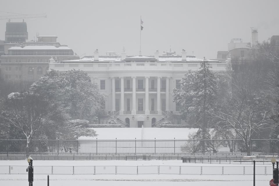 The White House is seen on a snowy day in Washington, DC, on January 16 (AFP via Getty Images)