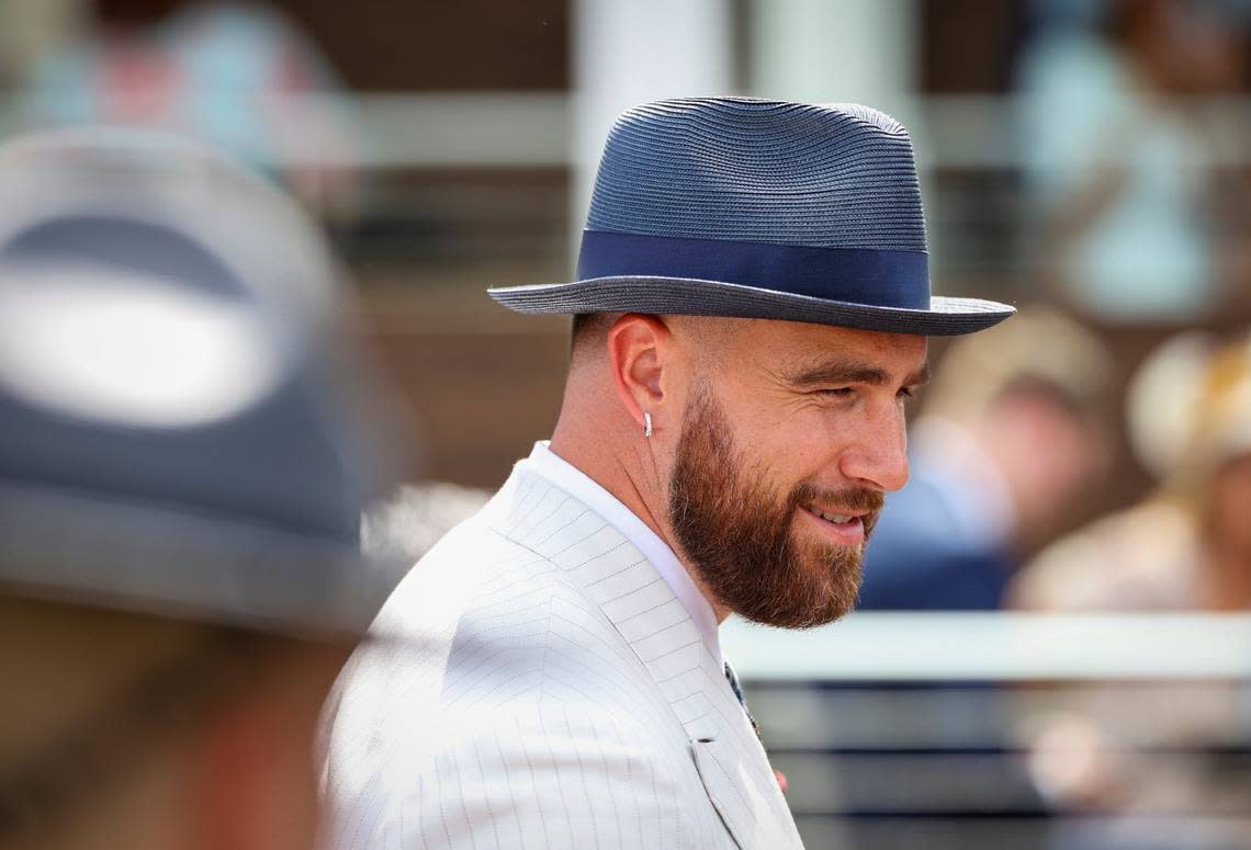 NFL star Travis Kelce, sometimes referred to as Mr. Taylor Swift, walks through the paddock at Churchill Downs before Saturday's Kentucky Derby.