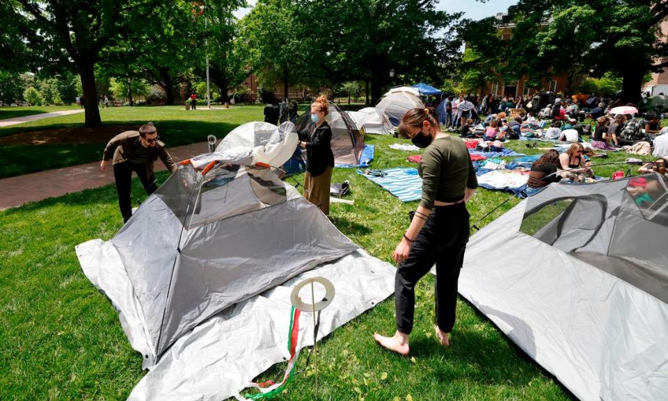 Protesters set up a tent as part of a Gaza Solidarity Encampment at Polk Place on the campus of UNC-Chapel Hill on early Friday afternoon, April 26, 2024.