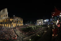 Pope Francis presides over the Via Crucis (Way of the Cross) torchlight procession on Good Friday, a Christian holiday commemorating the crucifixion of Jesus Christ and his death at Calvary, in front of Rome's Colosseum, in Rome, Friday, April 19, 2019. (AP Photo/Andrew Medichini)