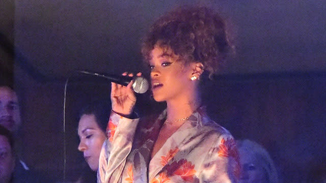 Rihanna went all out for her stylist Sonya Benson's New York City wedding this weekend! The "B**ch Better Have My Money" singer's good gal pal married James Markey, and while RiRi didn't attend the ceremony, she was on hand to perform at the party! <strong> PHOTOS: Rihanna Posts a Pic of Her New '1988' Tattoo -- See the Ink! </strong> Rihanna wore a kimono-like, silk lavender and red floral wrap dress for her friend's big day. The 2015 MTV Video Music Awards nominee paired the getup with silver stiletto sandals. An insider at the event told ET that Rihanna performed a few songs from the balcony overlooking the crowd at American Whiskey in New York City's Midtown neighborhood. During her performance, a slideshow of pictures of the couple was displayed. The 27-year-old pop star, who stayed at the party for a few hours, also said a few sweet words about the newlyweds. 247PapsTV <strong> MORE: Rihanna Parties With Lewis Hamilton in Scantily-Clad Costume at Barbados' Crop Over Celebration </strong> "Yasss!!!! Congrats to my beautiful and crazy @sonyabens on tying da knot!!!" RiRi Instagrammed along with a pic of the bride on her cell phone. "F**king love you girl!!! James you the real mvp doe!" <strong> WATCH: Alex Trebek Kinda Sorta Singing Rihanna's 'Umbrella' Makes Us Extremely Uncomfortable </strong> Rihanna already proved she was great at weddings when she served as a bridesmaid for her assistant Jennifer Morales' Hawaii nuptials in April. Check out her stunning purple gown: And if you think Rihanna's wedding style is wild, you should see what she wore to Barbados' Kadooment Day parade earlier this month!