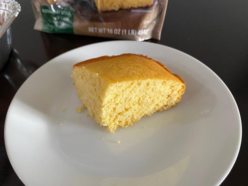 A slice of Marie Callender's cornbread on a white plate