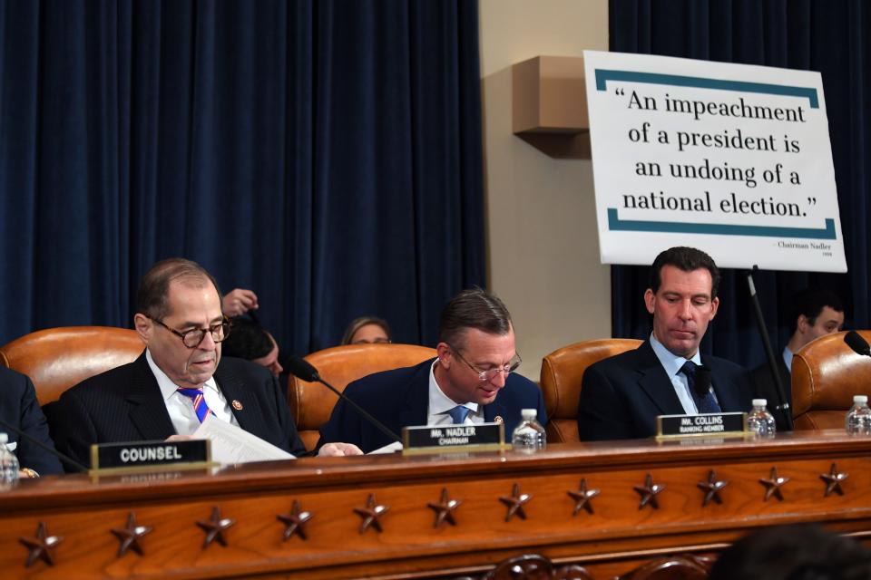 The House Judiciary Committee chairman, Rep. Jerry Nadler, D-N.Y., left, and the top Republican member, Rep. Doug Collins of Georgia, center, arrive at the panel's first formal impeachment inquiry hearing of President Donald Trump to explore how the Constitution applies to allegations of misconduct on Dec. 4, 2019.