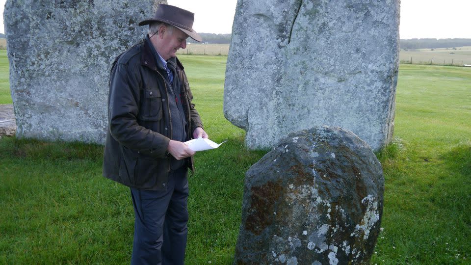 Professor Richard Bevins examines Bluestone Stone 46, a rhyolite that probably came from North Pembrokeshire. - Nick Pearce/Aberystwyth University