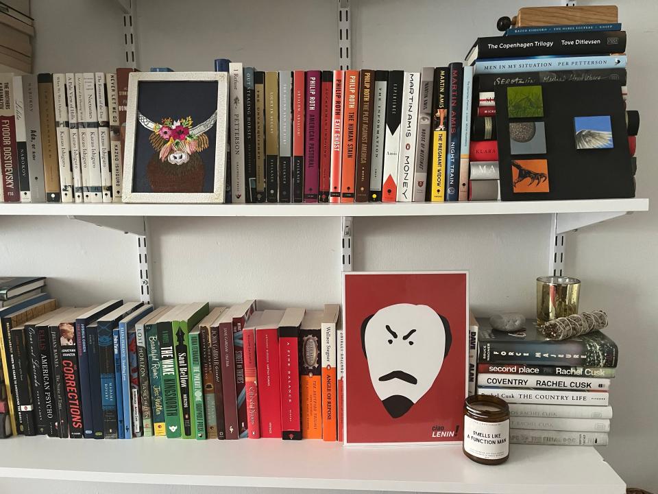 Books and fun prints on bookshelves