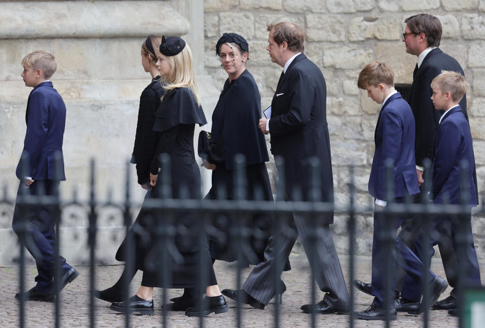 Children of the Queen Consort, Laura Lopes (centre) and Tom Parker Bowles arrive with their family at Westminster Abbeyahead of The State funeral of Queen Elizabeth II on September 19, 2022 in London, England. Elizabeth Alexandra Mary Windsor was born in Bruton Street, Mayfair, London on 21 April 1926. She married Prince Philip in 1947 and ascended the throne of the United Kingdom and Commonwealth on 6 February 1952 after the death of her Father, King George VI. Queen Elizabeth II died at Balmoral Castle in Scotland on September 8, 2022, and is succeeded by her eldest son, King Charles III.  (Photo by Chris Jackson/Getty Images)