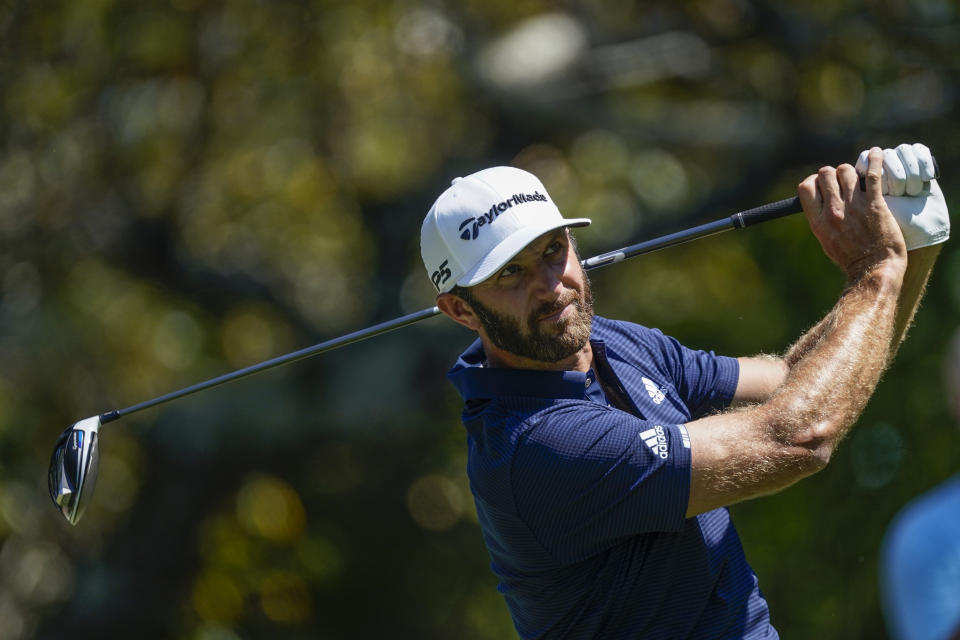 Dustin Johnson hits his tee shot on the fifth hole during the final round of the Tour Championship golf tournament at East Lake Golf Club in Atlanta, Monday, Sept. 7, 2020. (AP Photo/John Bazemore)