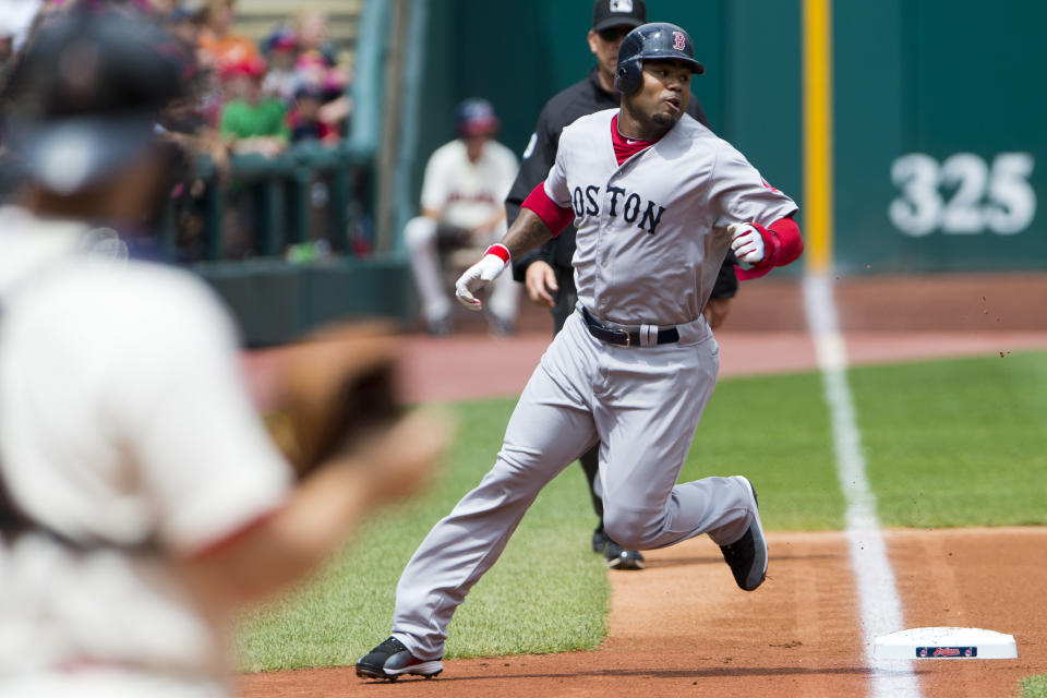 Carl Crawford #13 rounds third base on his way home off a double by Dustin Pedroia #15 of the Boston Red Sox during the first inning at Progressive Field on August 12, 2012 in Cleveland, Ohio. (Photo by Jason Miller/Getty Images)