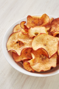 <p>Making your own apple chips is extremely easy—even without a fancy dehydrator. Our best tips for success are to pick the crispest apples you can (think Honeycrisp or Pink Lady, not Red Delicious or Fuji) and slice them as thinly as possible.</p><p>Get the <strong><a href="https://www.delish.com/cooking/recipe-ideas/recipes/a55596/healthy-apple-chips-recipe/" rel="nofollow noopener" target="_blank" data-ylk="slk:Air Fryer Cinnamon Apple Chips recipe;elm:context_link;itc:0;sec:content-canvas" class="link ">Air Fryer Cinnamon Apple Chips recipe</a></strong>.</p>