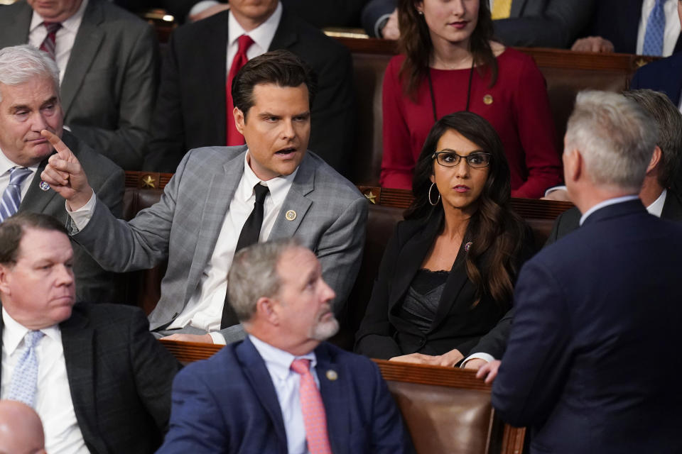 Rep. Matt Gaetz, R-Fla., talks to Rep. Kevin McCarthy, R-Calif., right, after Gaetz voted "present" in the House chamber as the House meets for the fourth day to elect a speaker and convene the 118th Congress in Washington, Friday, Jan. 6, 2023. (AP Photo/Alex Brandon)