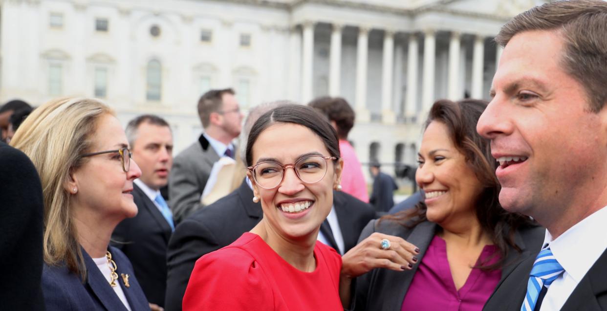 Rep.-elect Alexandria Ocasio-Cortez (D-N.Y.), center, joins a group photo Wednesday with the 116th Congress outside the U.S. Capitol. (Photo: Andrew Harrer/Bloomberg via Getty Images)