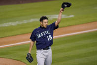 Seattle Mariners starting pitcher Yusei Kikuchi takes his hat off to right fielder Mitch Haniger after Haniger made a catch on a ball hit by Los Angeles Dodgers' Gavin Lux during the third inning of an interleague baseball game Tuesday, May 11, 2021, in Los Angeles. (AP Photo/Mark J. Terrill)