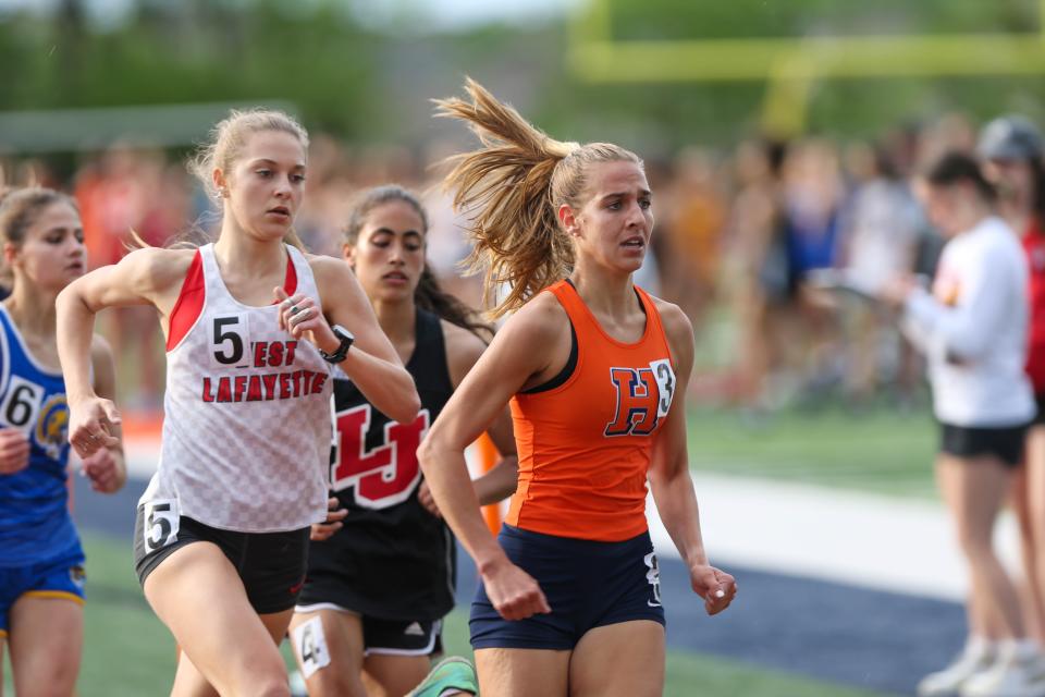 Emma Beimfohr (12), from Harrison High School, struggles to hold onto the lead in the Girls 1600 Meter Run at the IHSAA Girls Track and Field Sectional at Harrison High School, on May 17, 2022, in West Lafayette.