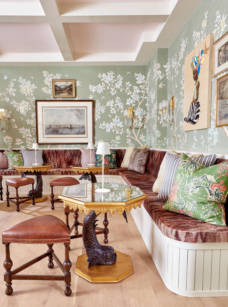 Green living room with corner seating and leather cushions by Corey Damen Jenkins