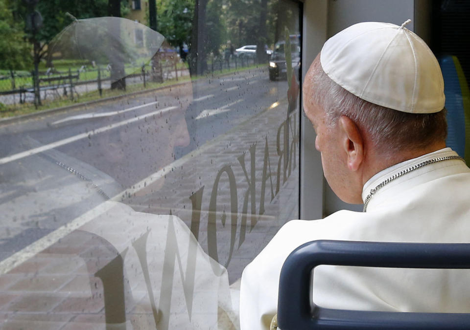 <p>Pope Francis looks out of the window as he drives in a public transportation tram to reach the venue of the World Youth Days in Krakow, Poland, July 28, 2016. Pope Francis is in Poland for a five-day pastoral visit and to attend the 31st World Youth Day on Sunday. (Photo: Stefano Rellandini/AP)</p>