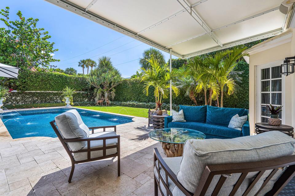 A covered patio overlooks the pool and rear lawn at a Palm Beach house at 168 Kings Road, which just sold for $14 million, the price recorded with the deed.