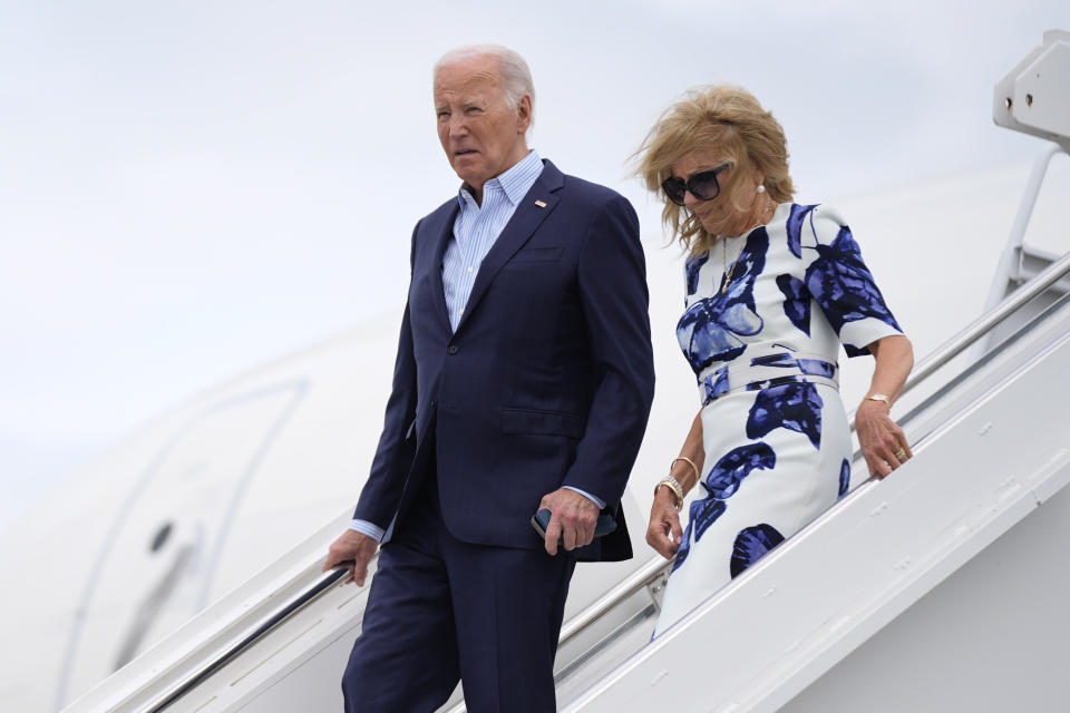 President Joe Biden, left, and first lady Jill Biden arrive at Francis S. Gabreski Airport, Saturday, June 29, 2024, in Westhampton Beach, N.Y. (AP Photo/Evan Vucci)