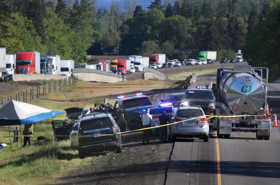 Traffic is backed up on Interstate 5 north of Eugene as Law enforcement secures the scene of a traffic stop that lead to the shooting of a suspect April 23, 2024.