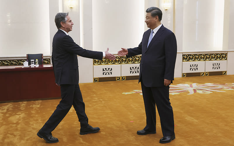 U.S. Secretary of State Antony Blinken shakes hands with Chinese President Xi Jinping