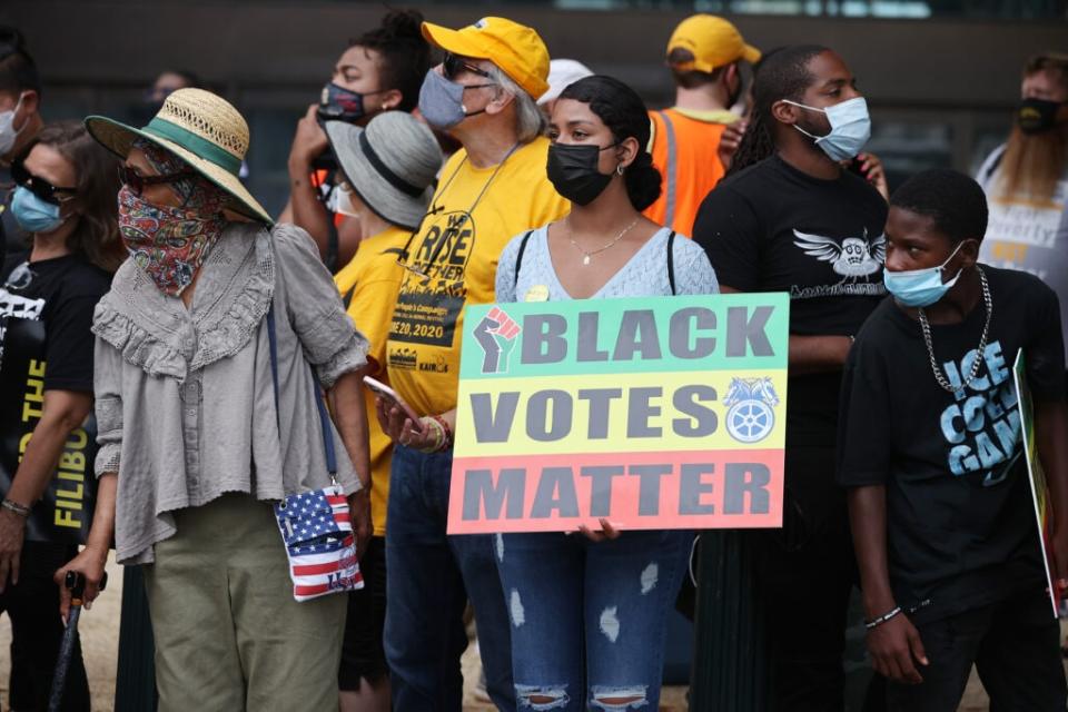 Hundreds of protesters gather outside the Hart Senate Office Building to demand and end to the filibuster, stronger voting rights, immigration reform, a $15 minimum wage and other progressive policies on August 02, 2021 in Washington, DC. (Photo by Chip Somodevilla/Getty Images)