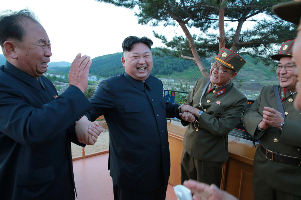 North Korean leader Kim Jong Un reacts with members of the Korean People's Army scientists and engineers in this undated photo released by North Korea's Korean Central News Agency (KCNA) on May 15, 2017. KCNA via REUTERS   REUTERS ATTENTION EDITORS - THIS IMAGE WAS PROVIDED BY A THIRD PARTY. EDITORIAL USE ONLY. REUTERS IS UNABLE TO INDEPENDENTLY VERIFY THIS IMAGE. NO THIRD PARTY SALES. SOUTH KOREA OUT.