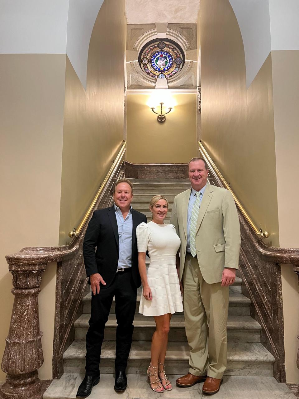 From left to right, Sugarfire Smoke House Springfield owners David and Erin Whitman and Missouri Sen. Eric Schmitt pose for a photo in the United States Capitol in June 2023.