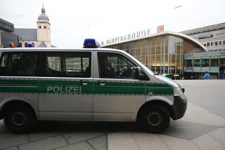 A police vehicle patrols at the main square and in front of the central railway station in Cologne, Germany, January 5, 2016. REUTERS/Wolfgang Rattay