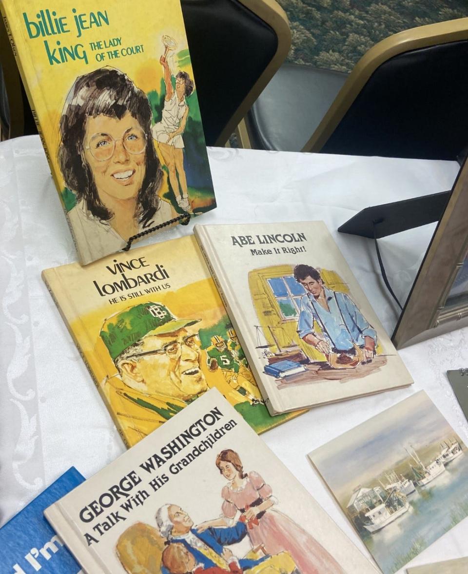 A collection of books illustrated by John Nelson.