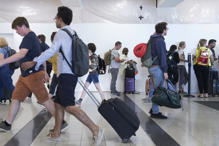 Pasajeros en el aeropuerto John F. Kennedy de New York. (Gus Powell/The New York Times)