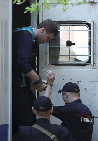 Russian soccer player Alexander Kokorin, who is charged with a brutal assault and held in custody, walks out of a truck before a court hearing in Moscow, Russia May 6, 2019. REUTERS/Evgenia Novozhenina