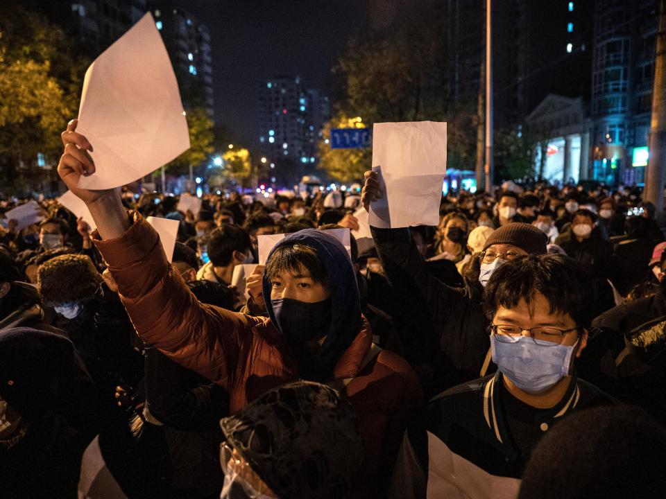 rotesters hold up pieces of paper against censorship and China's strict zero COVID measures on November 27, 2022 in Beijing, China.